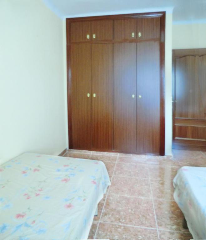 Posteľ alebo postele v izbe v ubytovaní Apartamento Corregidor