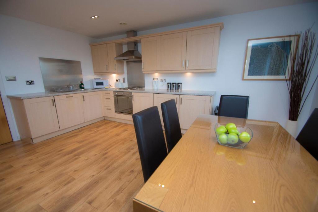 Kuchyň nebo kuchyňský kout v ubytování Ocean Serviced Apartments