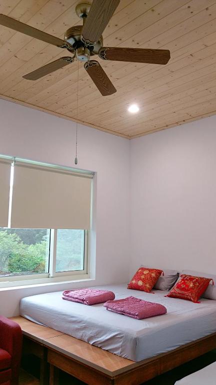 Postel nebo postele na pokoji v ubytování Fei Ying Homestay