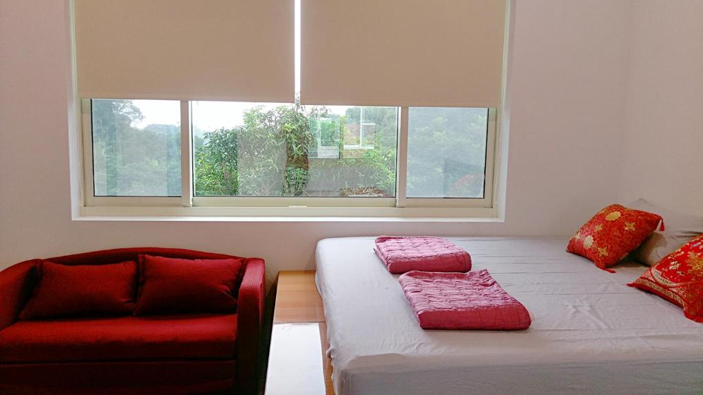 Postel nebo postele na pokoji v ubytování Fei Ying Homestay