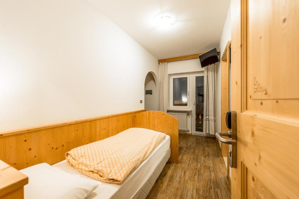Postel nebo postele na pokoji v ubytování Garni Tyrolia
