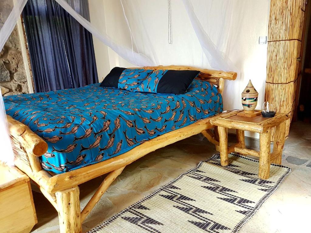 Postel nebo postele na pokoji v ubytování Kivu Paradis Resort