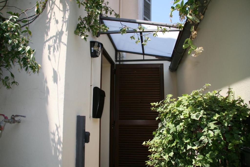 an entrance to a house with a wooden door at GARAGE36 in Parma