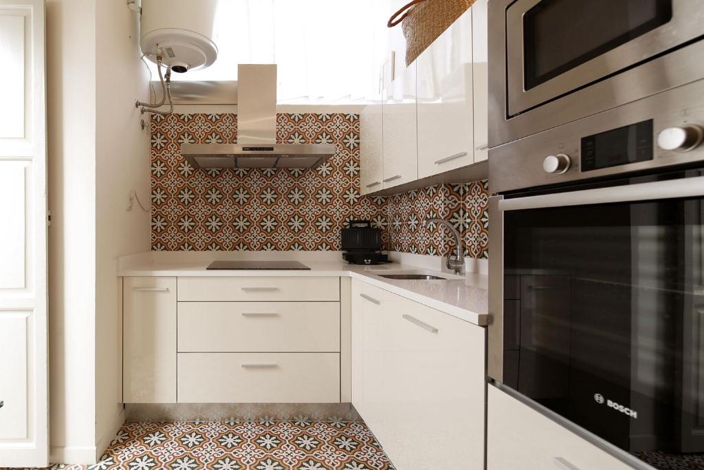 Kuchyň nebo kuchyňský kout v ubytování Veoapartment Quintana Terrace