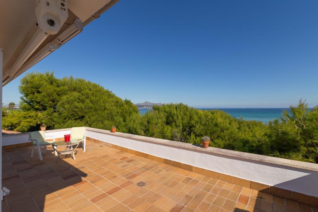 a view of the ocean from the roof of a house at Franciscus in Playa de Muro