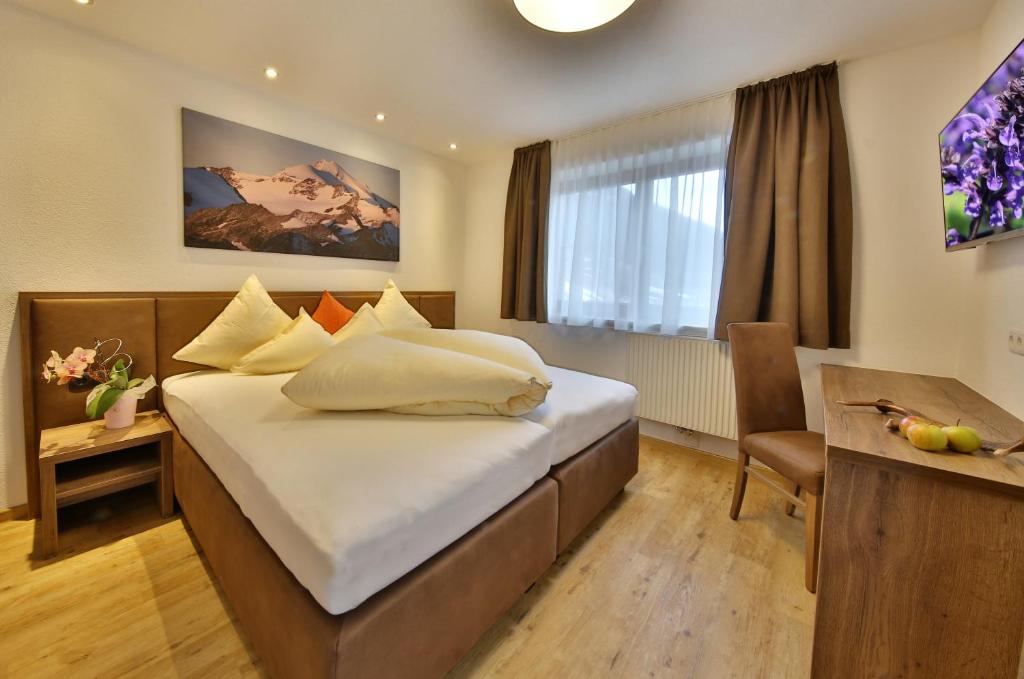Posteľ alebo postele v izbe v ubytovaní Hotel Garni Fiegl Apart