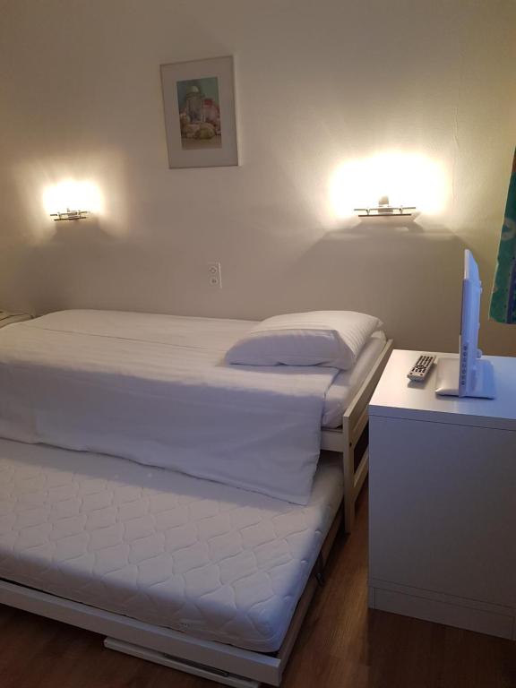 Postel nebo postele na pokoji v ubytování Hotel Elite
