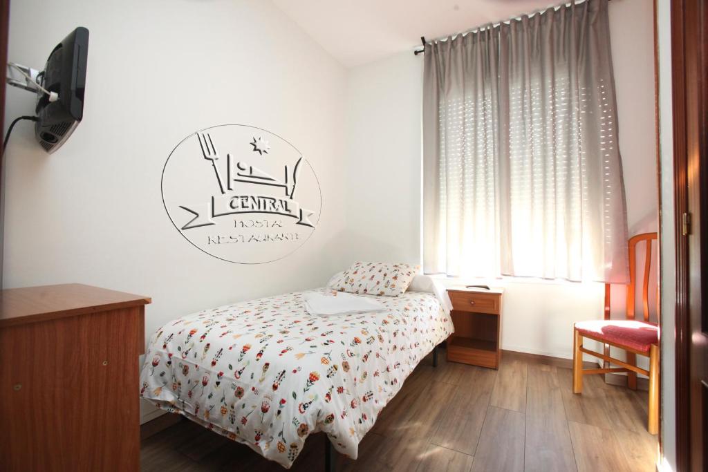 Posteľ alebo postele v izbe v ubytovaní Hostal Restaurante Central