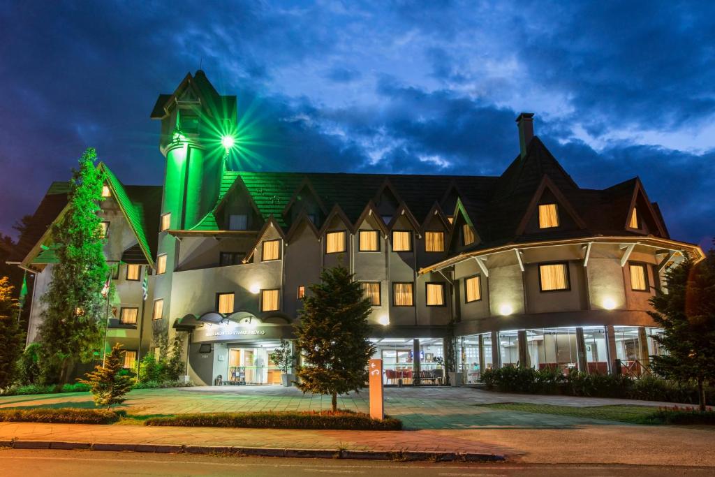 a large building with a star on top of it at Hotel Laghetto Premio in Gramado
