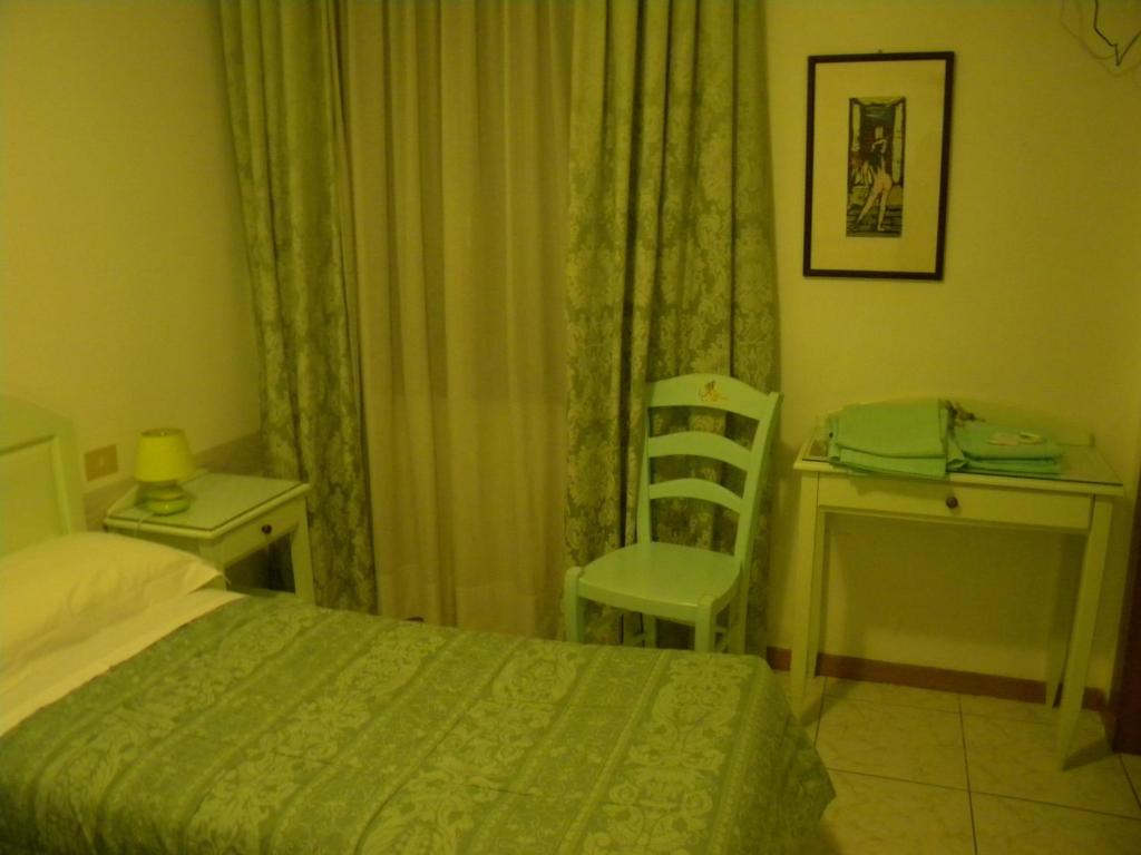 Postel nebo postele na pokoji v ubytování Hotel Adua