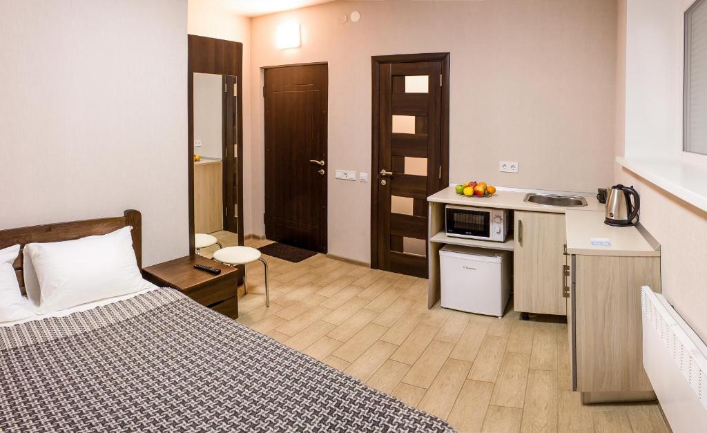 Kuchyň nebo kuchyňský kout v ubytování Apart Hotel Smart Studio