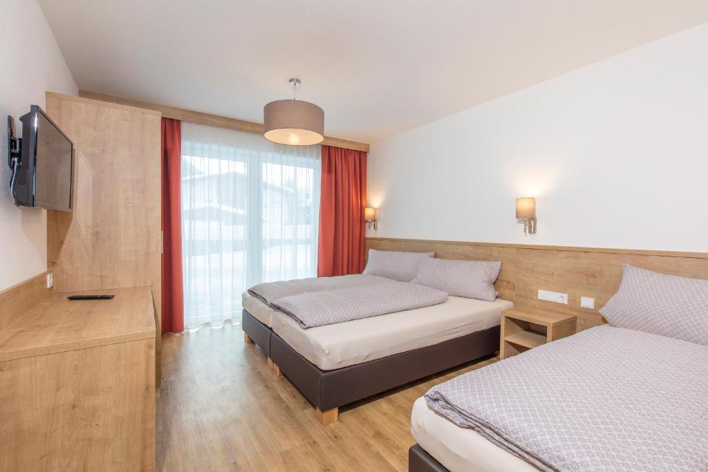 Posteľ alebo postele v izbe v ubytovaní Apart Ida