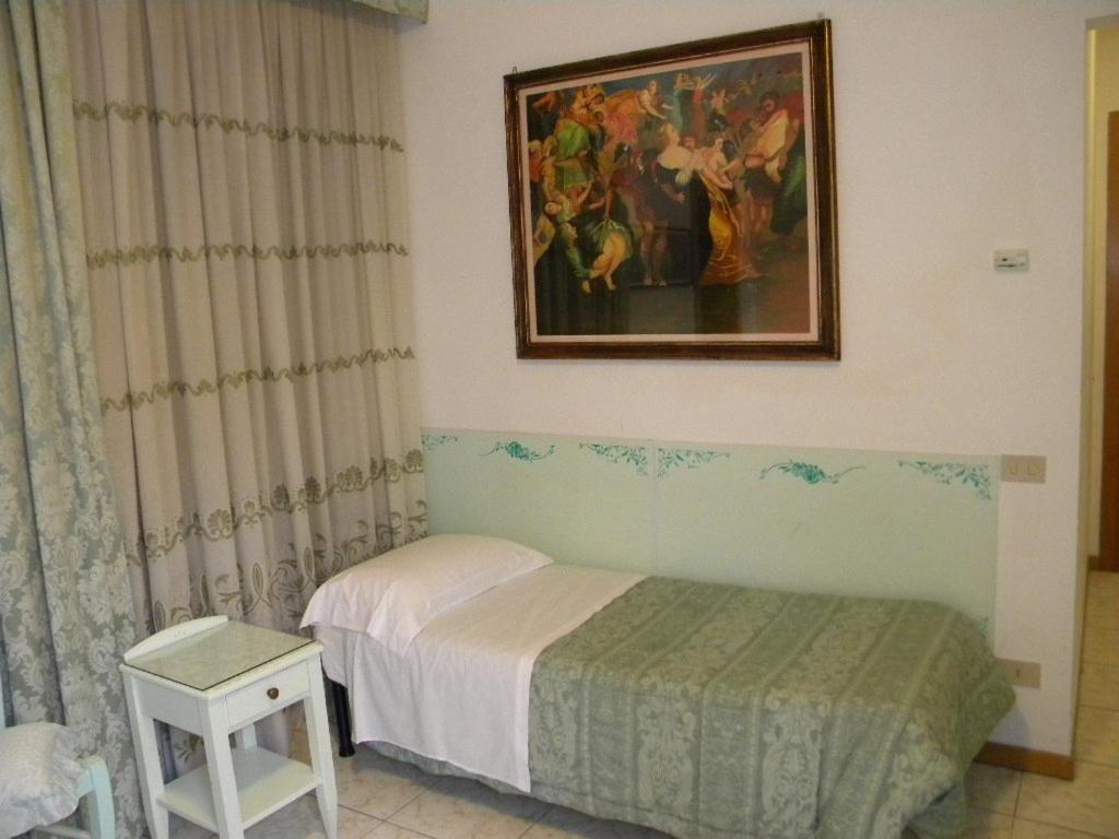 Postel nebo postele na pokoji v ubytování Hotel Adua