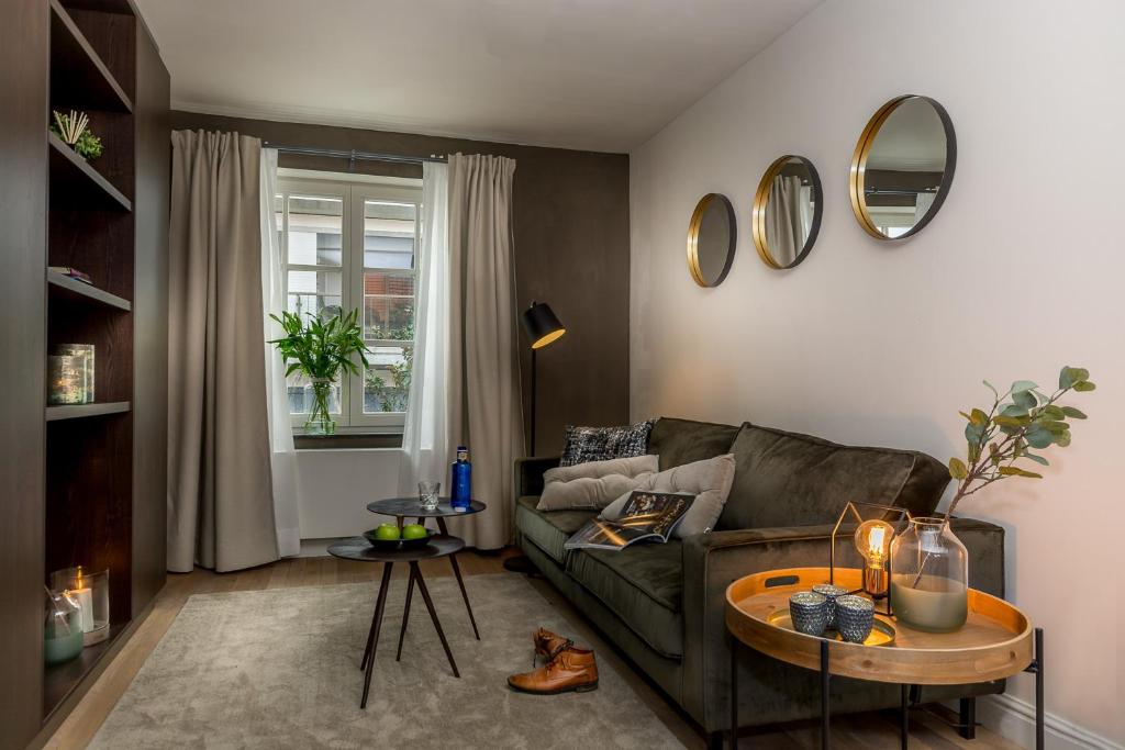 a living room with a couch and a table at Zoet Valkenburg in Valkenburg