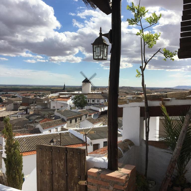 a view from the roof of a house with a windmill at Casa La Maquica in Campo de Criptana