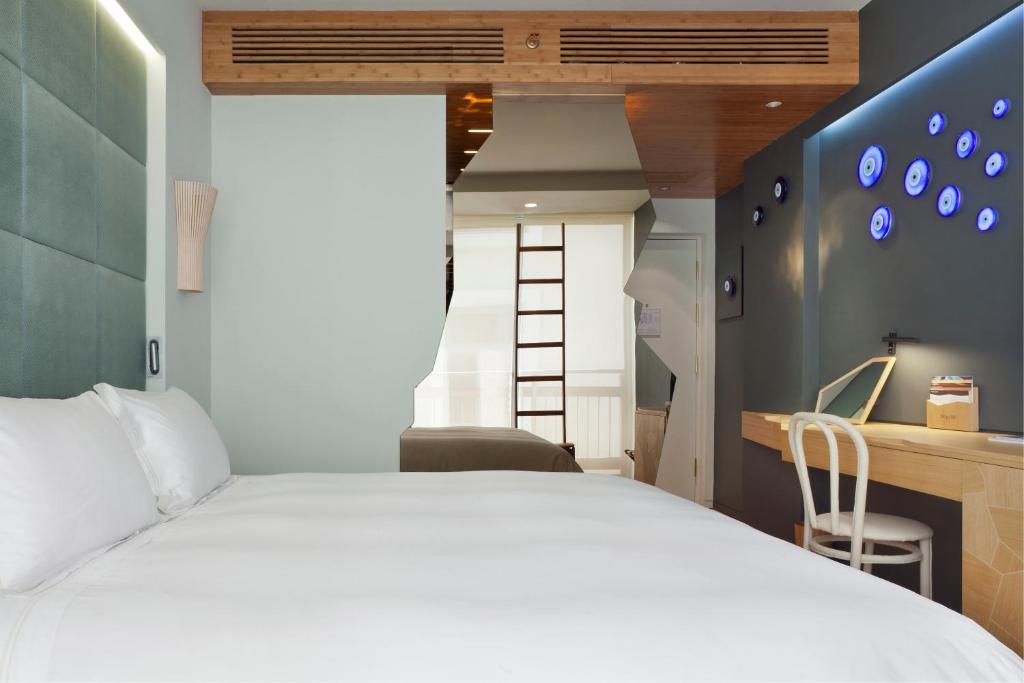 Postel nebo postele na pokoji v ubytování New Hotel