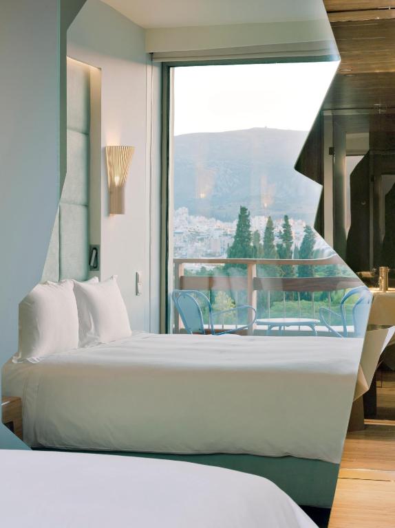Postel nebo postele na pokoji v ubytování New Hotel