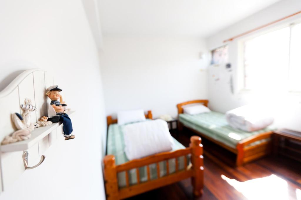 Postel nebo postele na pokoji v ubytování Alice Springs Homestay