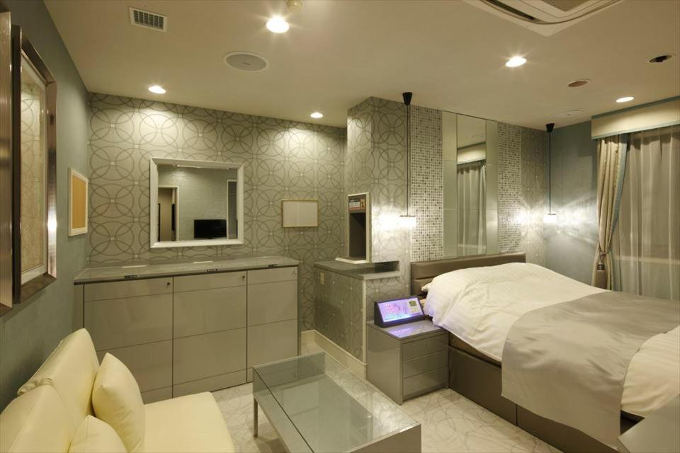 Postel nebo postele na pokoji v ubytování Hotel Waltz Okazaki (Adult Only)