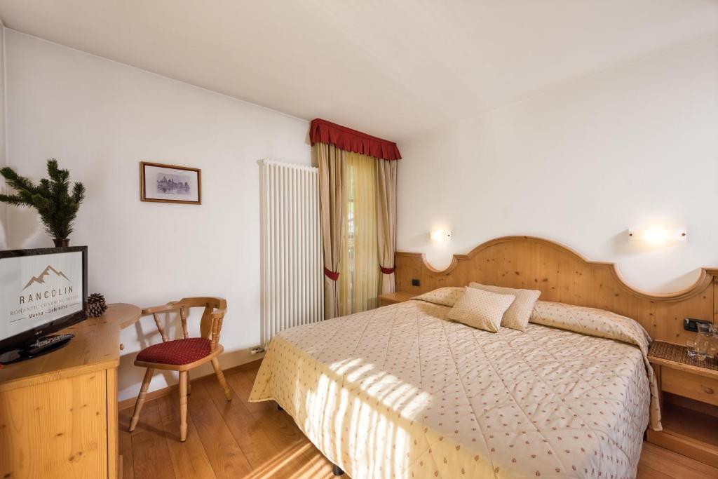 Postel nebo postele na pokoji v ubytování Romantic Charming Hotel Rancolin