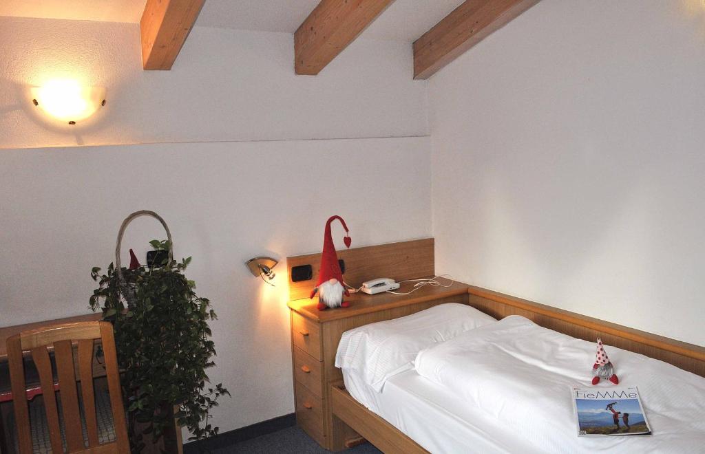 Postel nebo postele na pokoji v ubytování Albergo Antico
