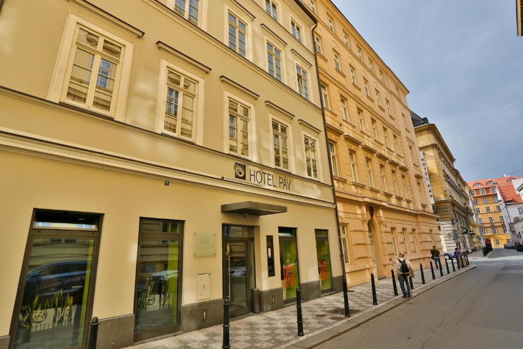 a row of buildings on a street in a city at Hotel Páv in Prague
