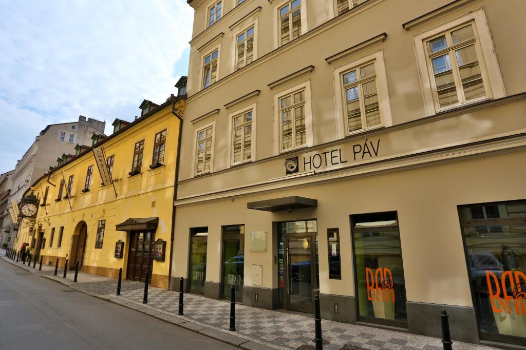 a row of buildings on a city street at Hotel Páv in Prague
