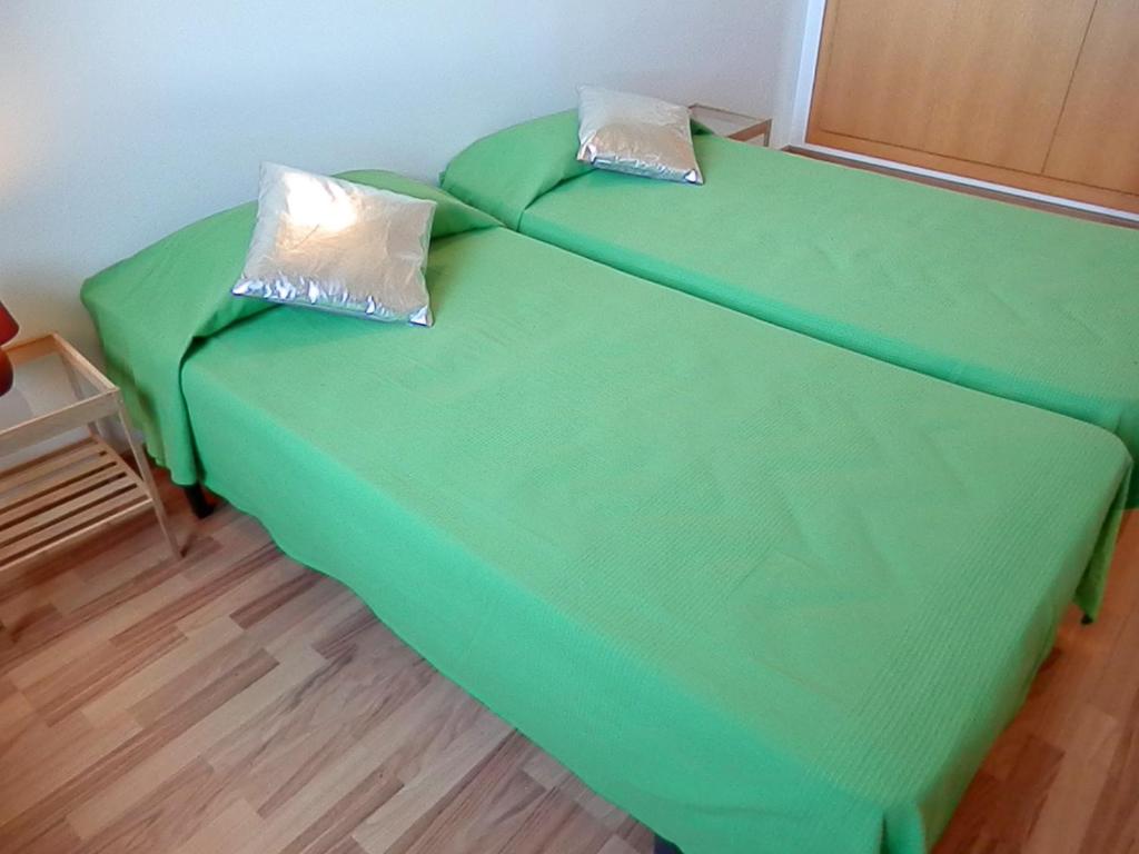 Postel nebo postele na pokoji v ubytování Apartamentos La Solana 3000