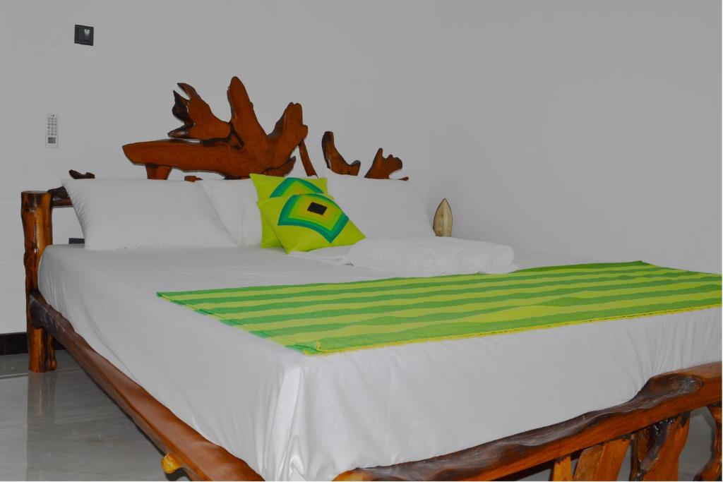 Postel nebo postele na pokoji v ubytování Hewage Resort