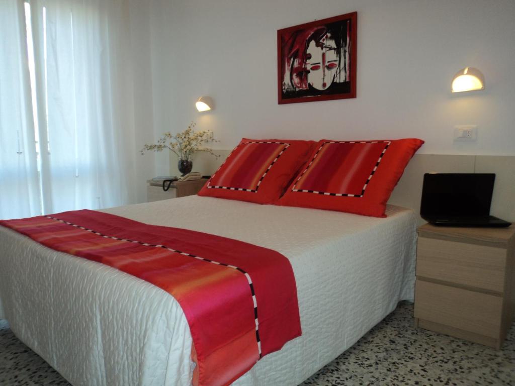 A bed or beds in a room at Hotel Irene