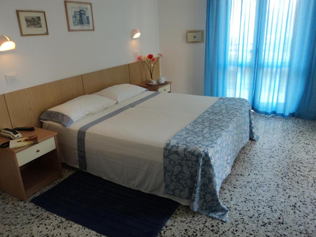 A bed or beds in a room at Hotel Irene