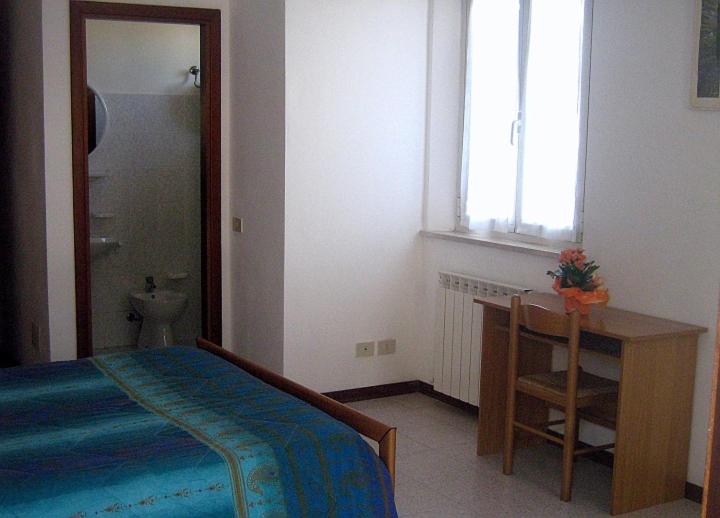 Postel nebo postele na pokoji v ubytování Camere Carloni