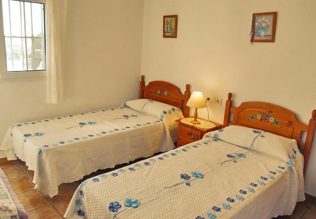 Postel nebo postele na pokoji v ubytování Villa Dolores