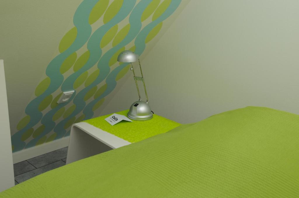 Postel nebo postele na pokoji v ubytování Hotel CoCo Aps