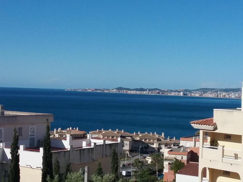 a view of the ocean from a city at Appartment Beach Golf in Benalmádena