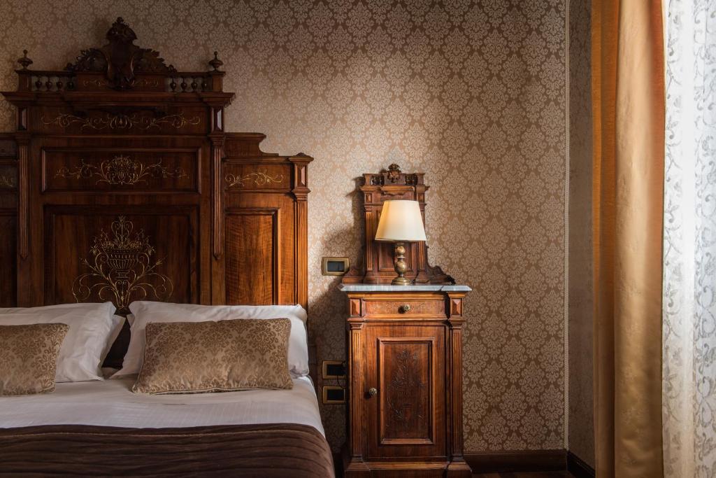 Postel nebo postele na pokoji v ubytování Palazzo Bembo - Exclusive Accommodation