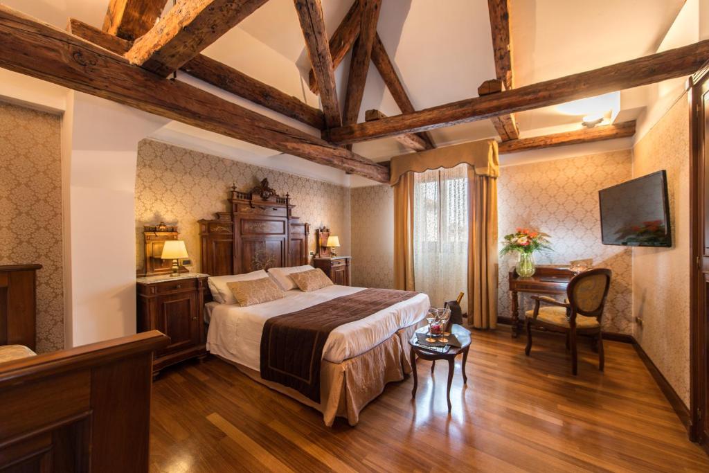 Postel nebo postele na pokoji v ubytování Palazzo Bembo - Exclusive Accommodation