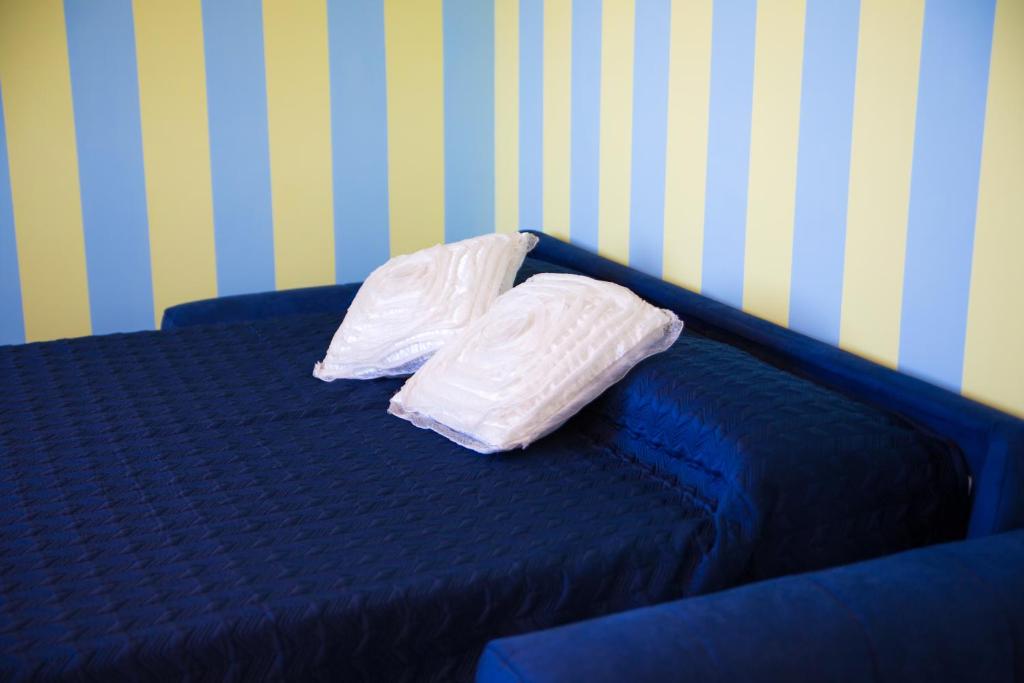 Postel nebo postele na pokoji v ubytování Lemon Flats Sorrento