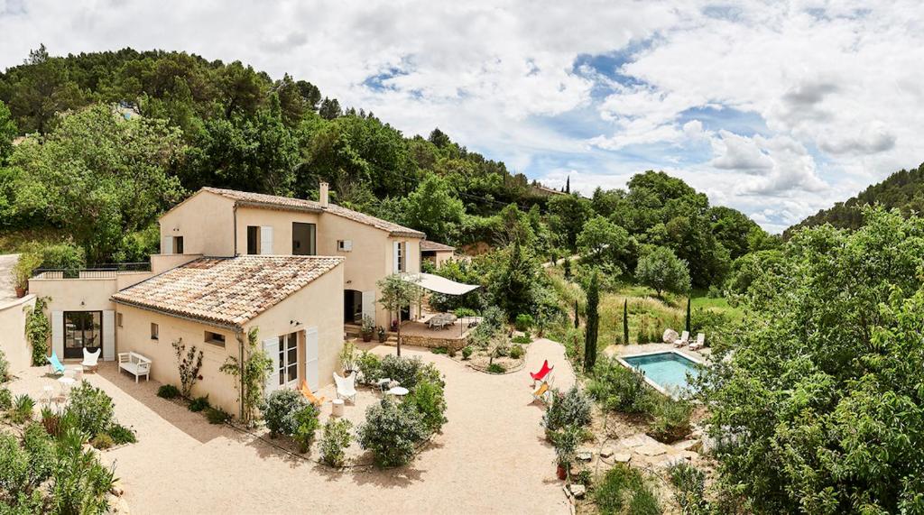 an aerial view of a house and a swimming pool at Mas De La Baume in Lafare