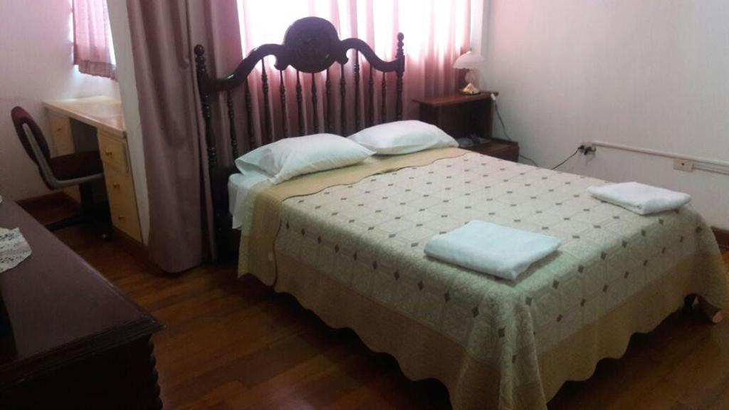 Postel nebo postele na pokoji v ubytování Hostal Camiluz