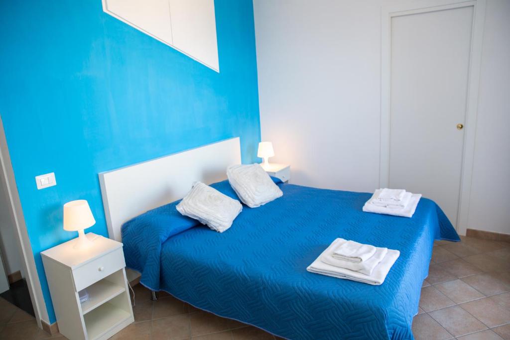 Postel nebo postele na pokoji v ubytování Lemon Flats Sorrento