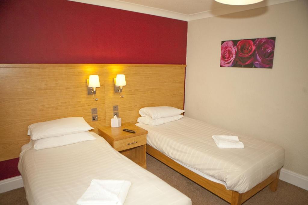 Postel nebo postele na pokoji v ubytování Wheatlands Lodge Hotel