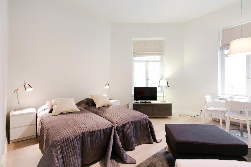 Ένα ή περισσότερα κρεβάτια σε δωμάτιο στο Forenom Serviced Apartments Turku Uudenmaankatu