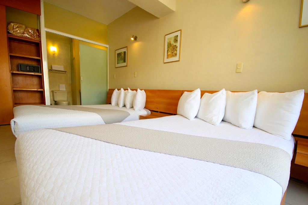 Postel nebo postele na pokoji v ubytování Hotel Balcón del Cielo