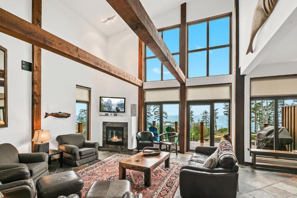 a living room with couches and a fireplace at Black Rock Ridge in Ucluelet