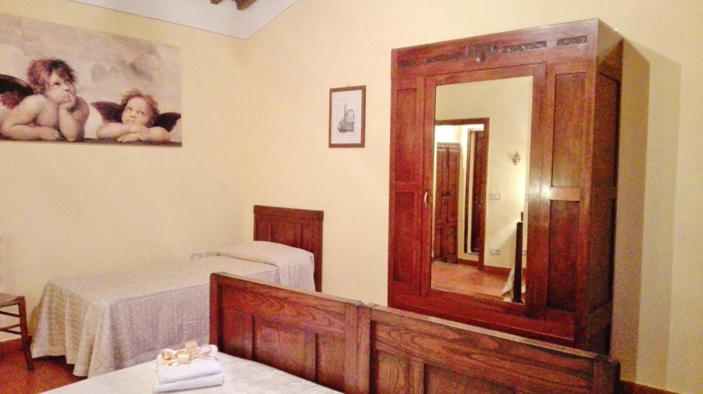 Postel nebo postele na pokoji v ubytování Podere Il Leccione