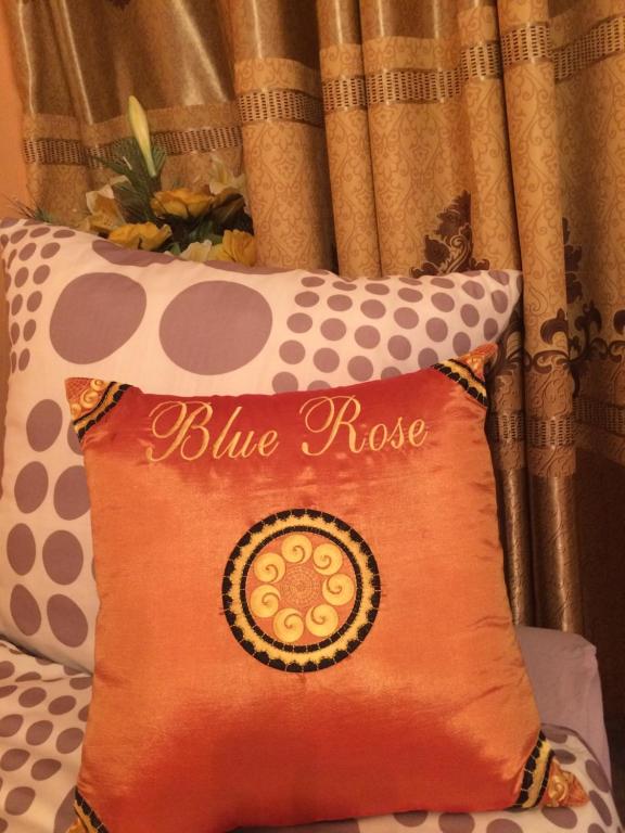 Postel nebo postele na pokoji v ubytování Blue Rose Apartman