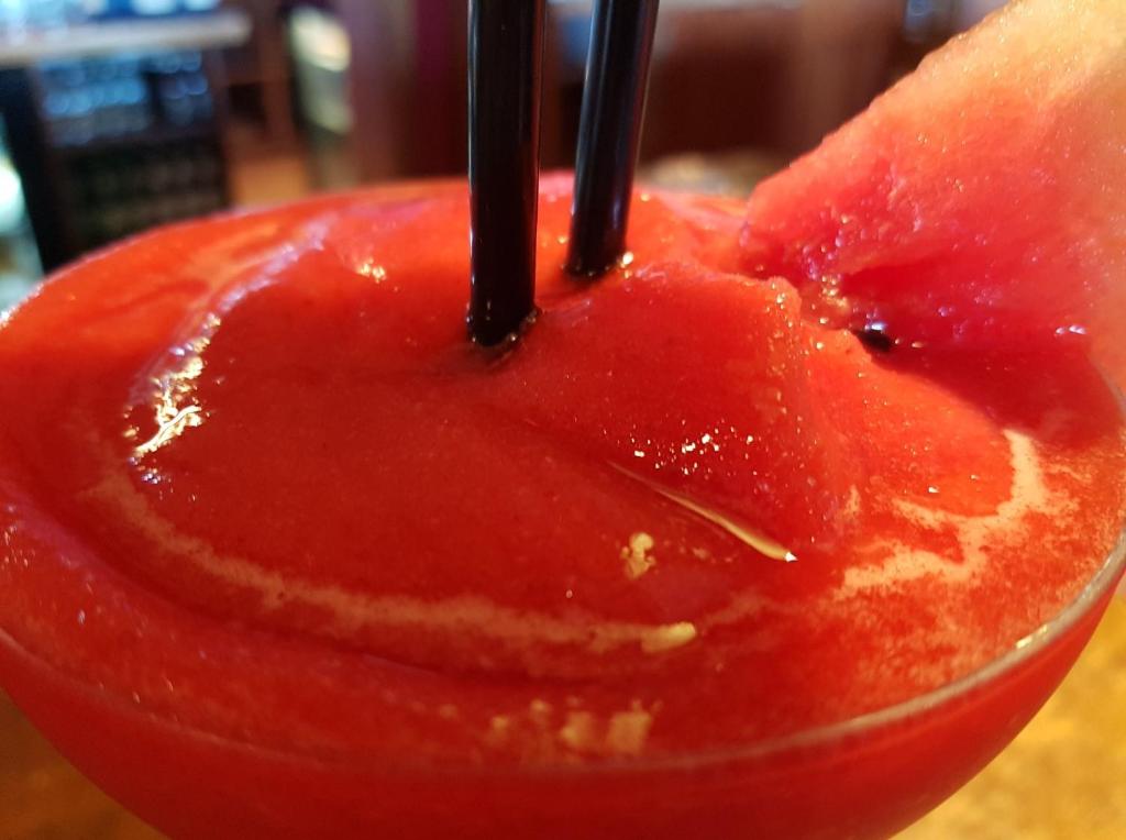 a red drink with two chopsticks sticking out of it at Caisleain Oir Hotel in Annagry