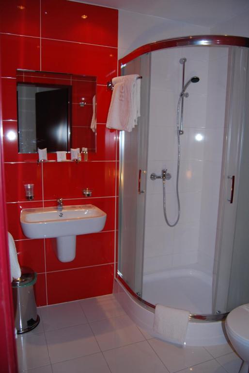 Koupelna v ubytování Amigo Hotel