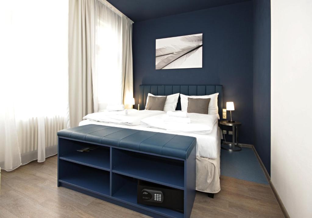 Кровать или кровати в номере Alveo Suites